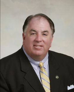 (talk | contribs)	({{Information |Description=Picture shows middle aged man smilling, wearing a navy blue suit, light blue shirt and yellow striped tie. |Source=Self |Date=May 5, 2009 |Author=Self |Permission=Self |other_versions= }})